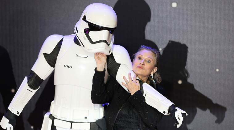 FILE PHOTO: Carrie Fisher poses for cameras as she arrives at the European Premiere of "Star Wars, The Force Awakens" in Leicester Square, London, December 16, 2015. REUTERS/Paul Hackett/File Photo